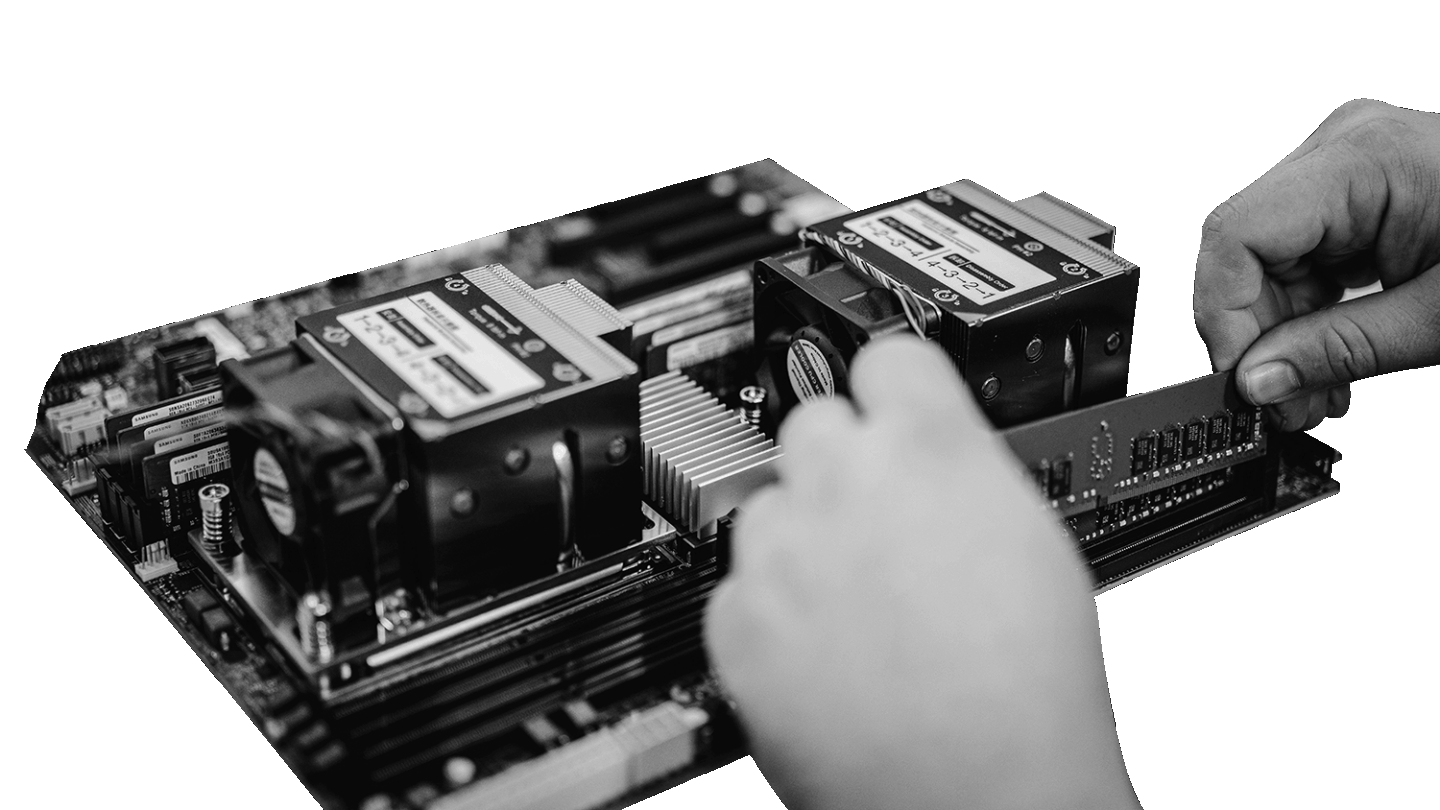 Hands installing computer memory into server hardware during a hands-on cybersecurity and IT infrastructure training course.